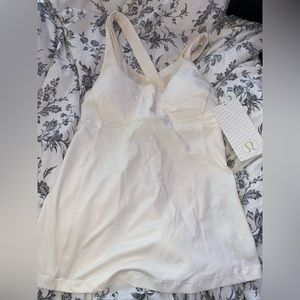 Cute off white coloured lulu top.
